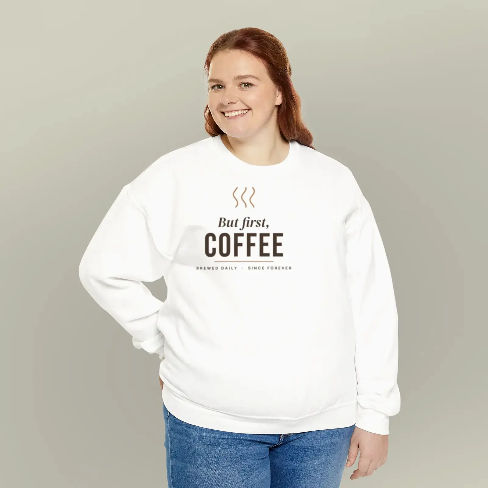 "But first, coffee", an example design by Vessim, printed on a crewneck sweatshirt