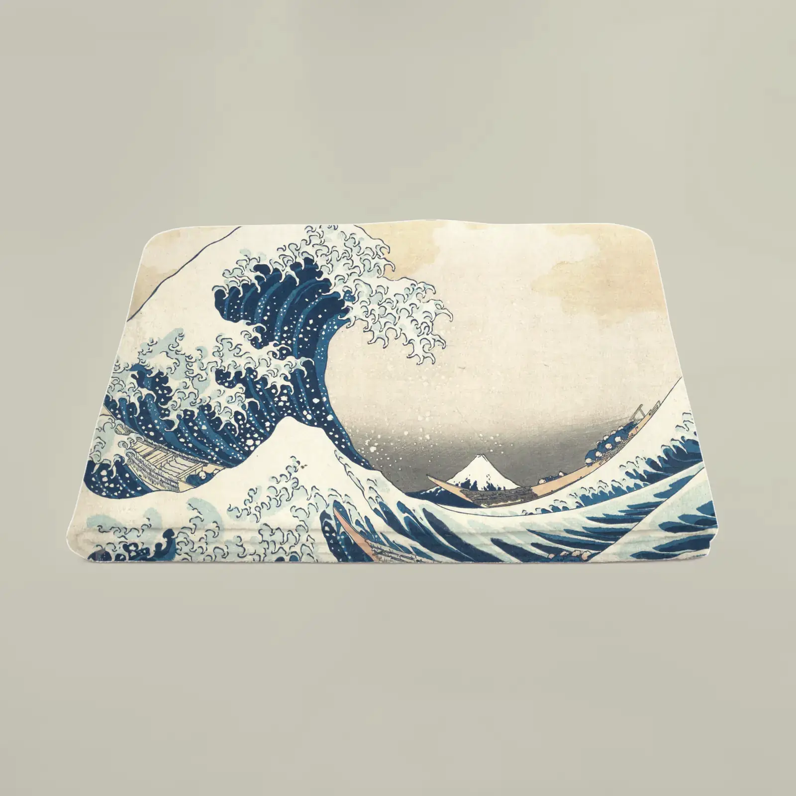 Beach towel shown with The Great Wave off Kanagawa by Katsushika Hokusai, a public-domain example